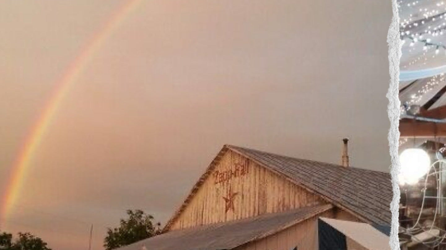 Barn with rainbow in the sky