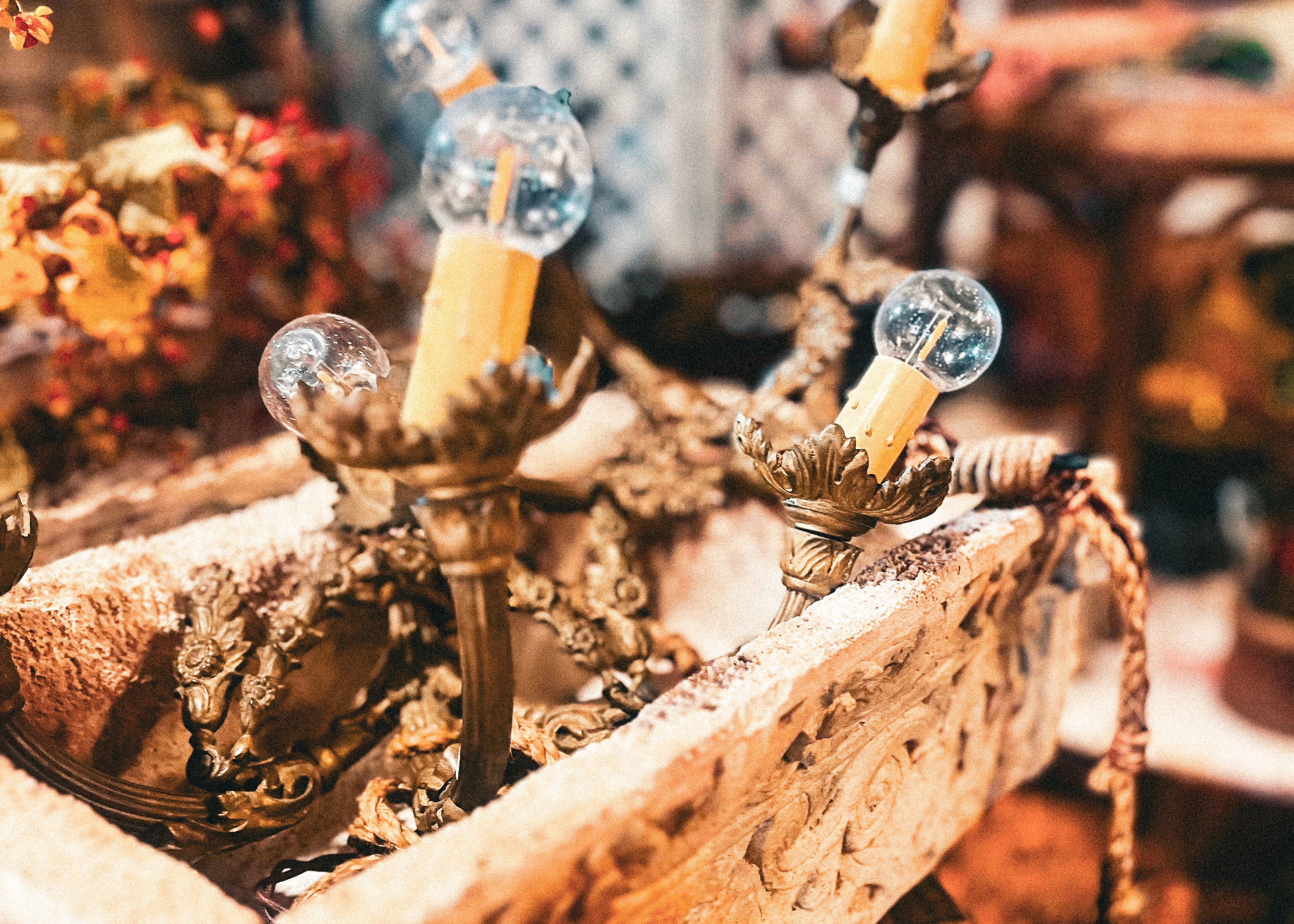 Decorative lamp with glass bulbs on a rustic wooden surface