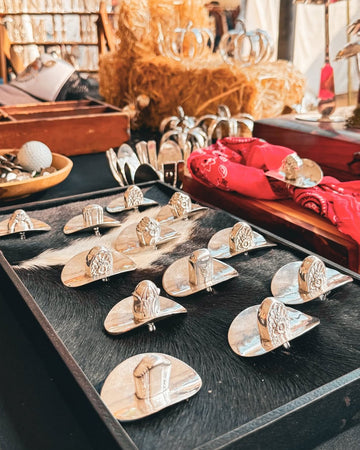 Display of rings on a table with a scenic background