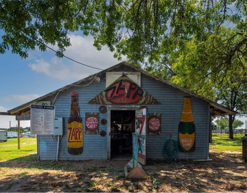 Painted building with vintage-style advertising on a sunny day
