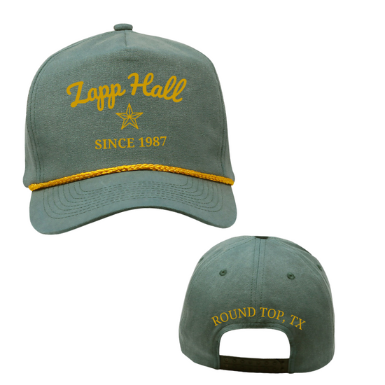 Green cap with yellow text and star design on a white background